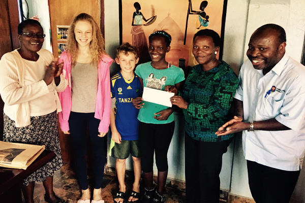 Froese children present donation to save mothers